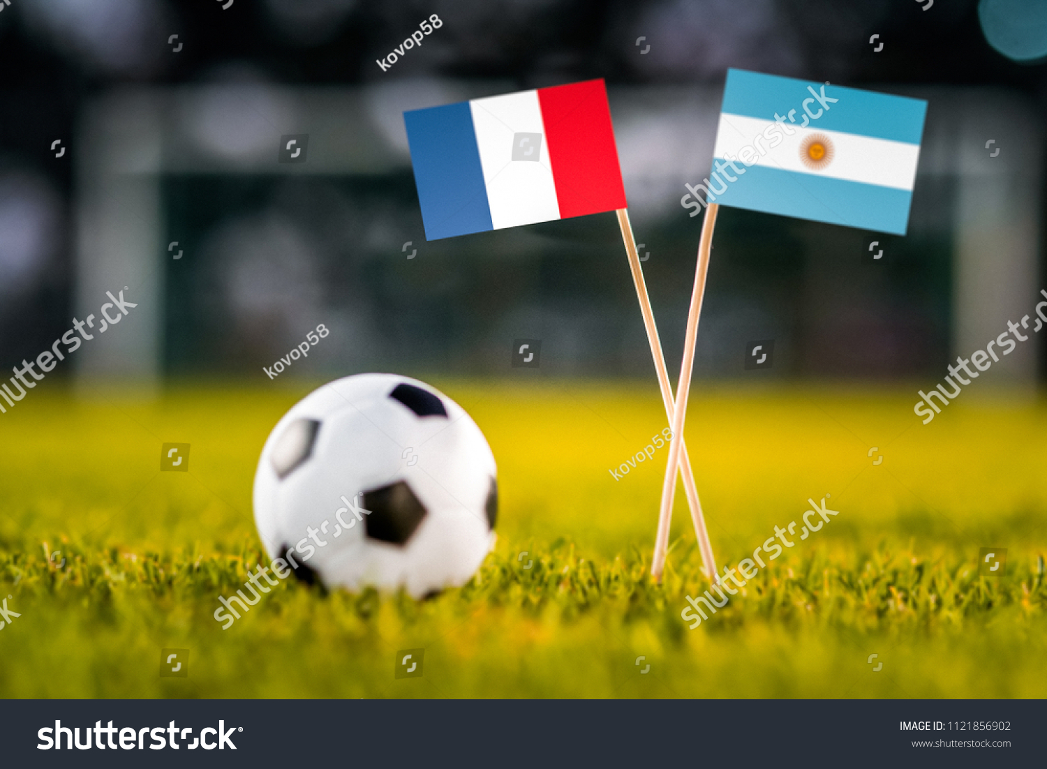 MOSCOW, RUSSIA - APRIL, 24, 2018: France - Argentina, 16-final, eight final, 30. June, Football FIFA World Cup, Russia 2018, National Flags on green grass, white football ball on ground. Play-off #1121856902