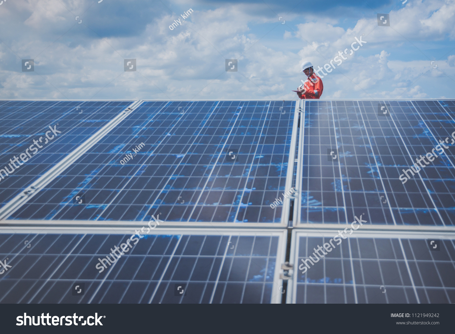 operation and maintenance in solar power plant ; engineering team working on checking and maintenance in solar power plant ,solar power plant to innovation of green energy for life
 #1121949242