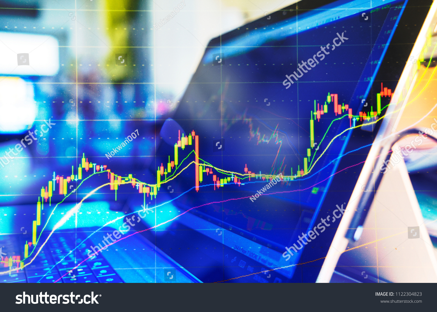 Computer screen with selective focus of technical price graph and indicator, red and green candlestick chart, market volatility, up and down trend. Stock trading, crypto currency background. #1122304823