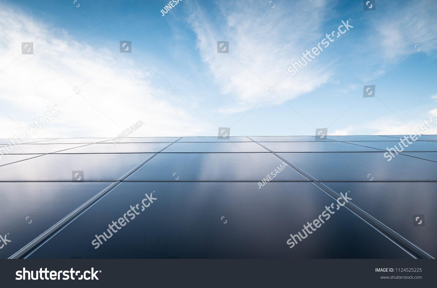 solar power, photovoltaic power plant and blue sky with clouds in the city. #1124525225