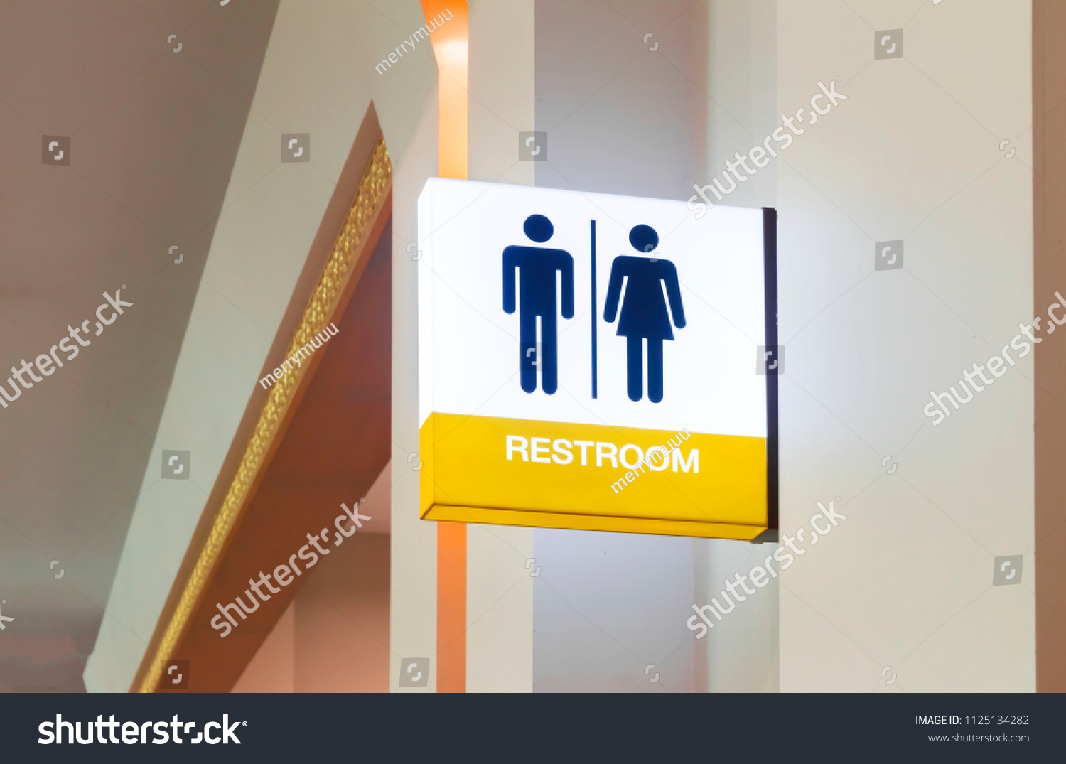 Restroom sign or toilet sign made of electric light box with man and woman icon set  symbol on white concrete wall background, modern, hygiene and clean restroom concept
 #1125134282