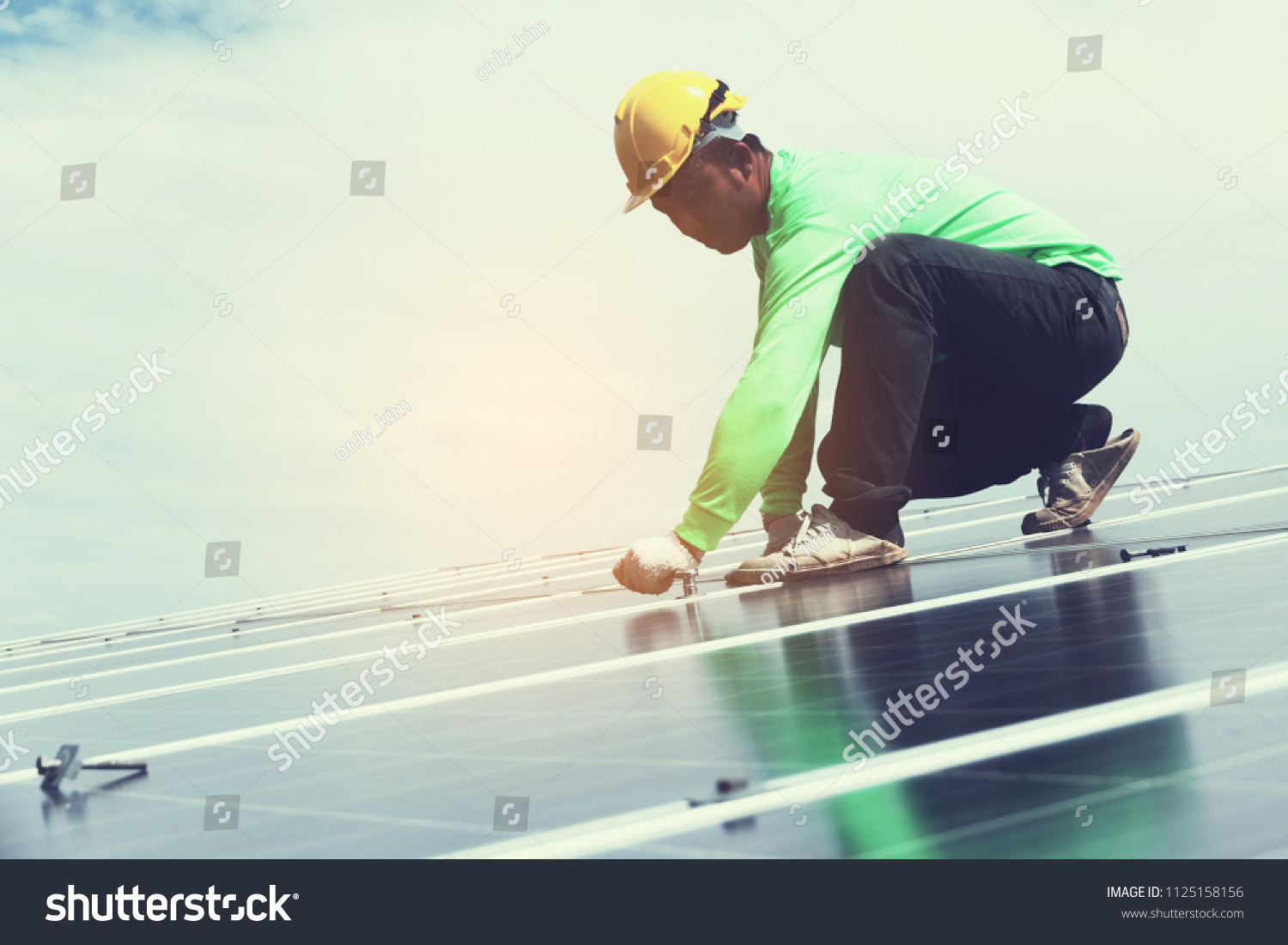 engineer team working on replacement solar panel in solar power plant;engineer and electrician team swapping and install solar panel after solar panel voltage drop
 #1125158156