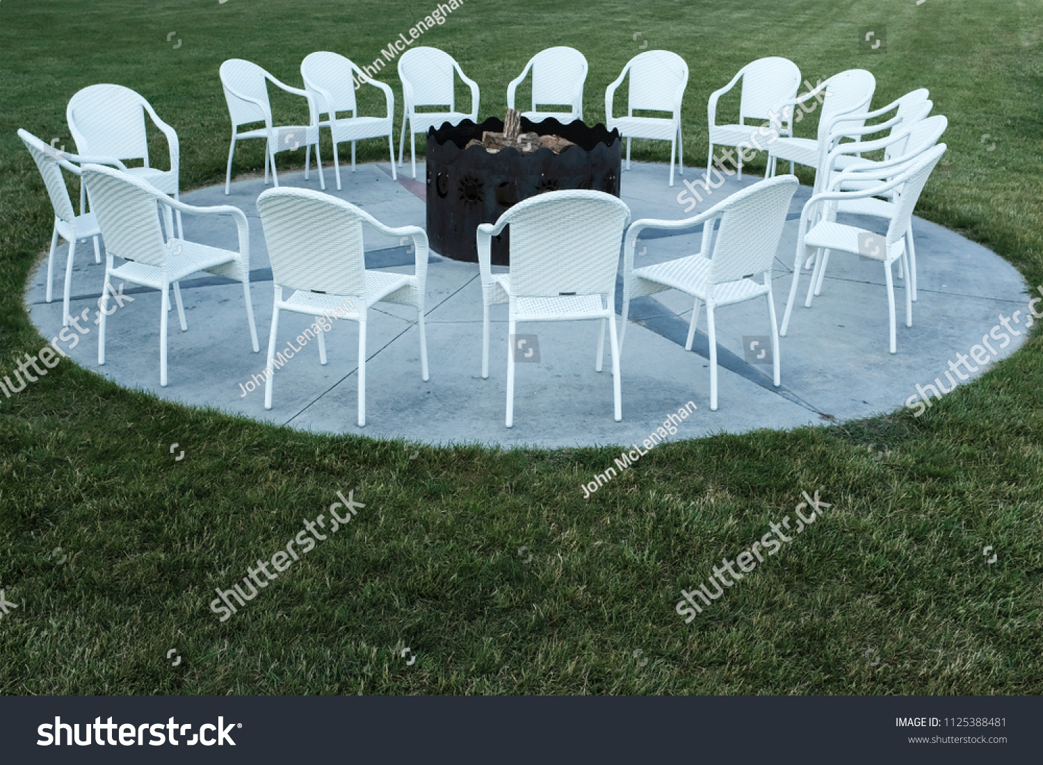 Fire Pit With A Cirlce Of Chairs For Vacation #1125388481