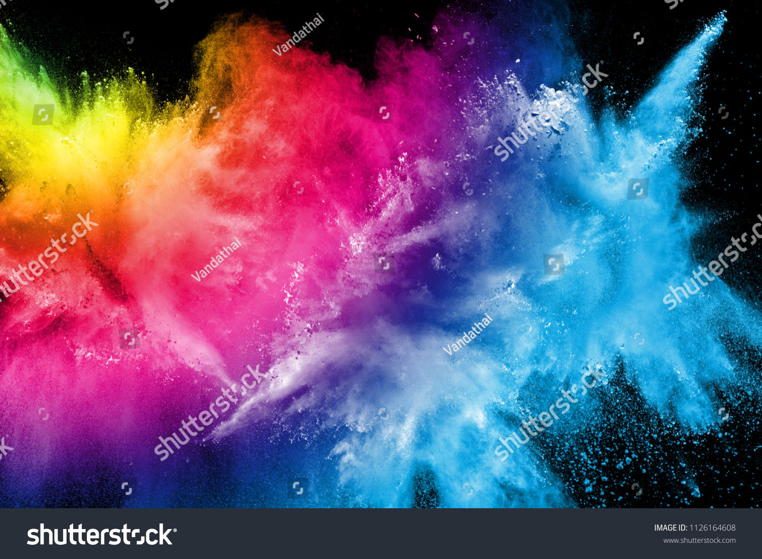 Abstract multi color powder explosion on black background.  Freeze motion of color dust  particles splash. Painted Holi in festival. #1126164608