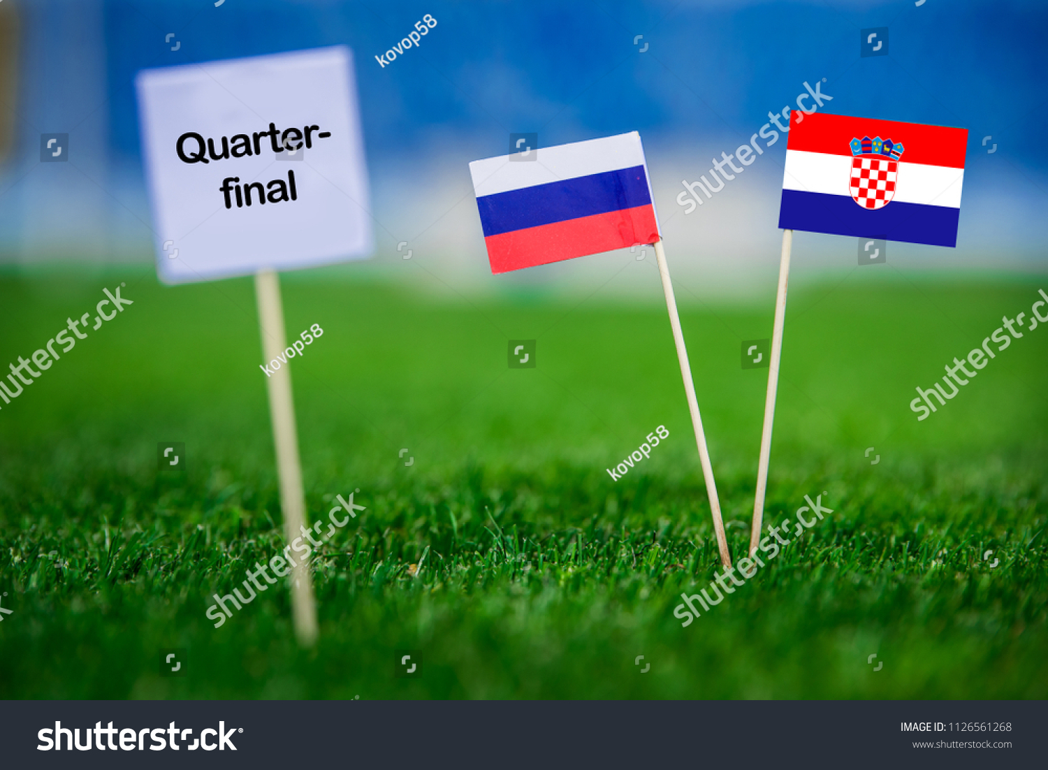 Russia and Croatia national Flag on football green grass. White table with tittle “QUARTER-FINAL” #1126561268