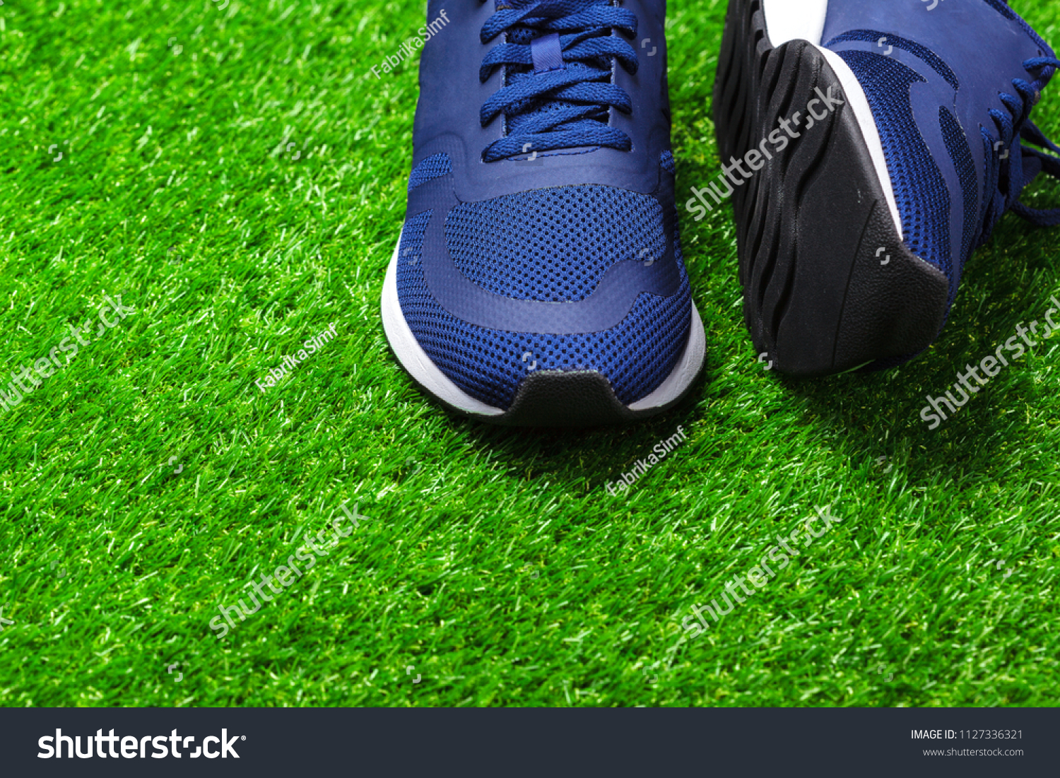 Sport shoes on grass #1127336321