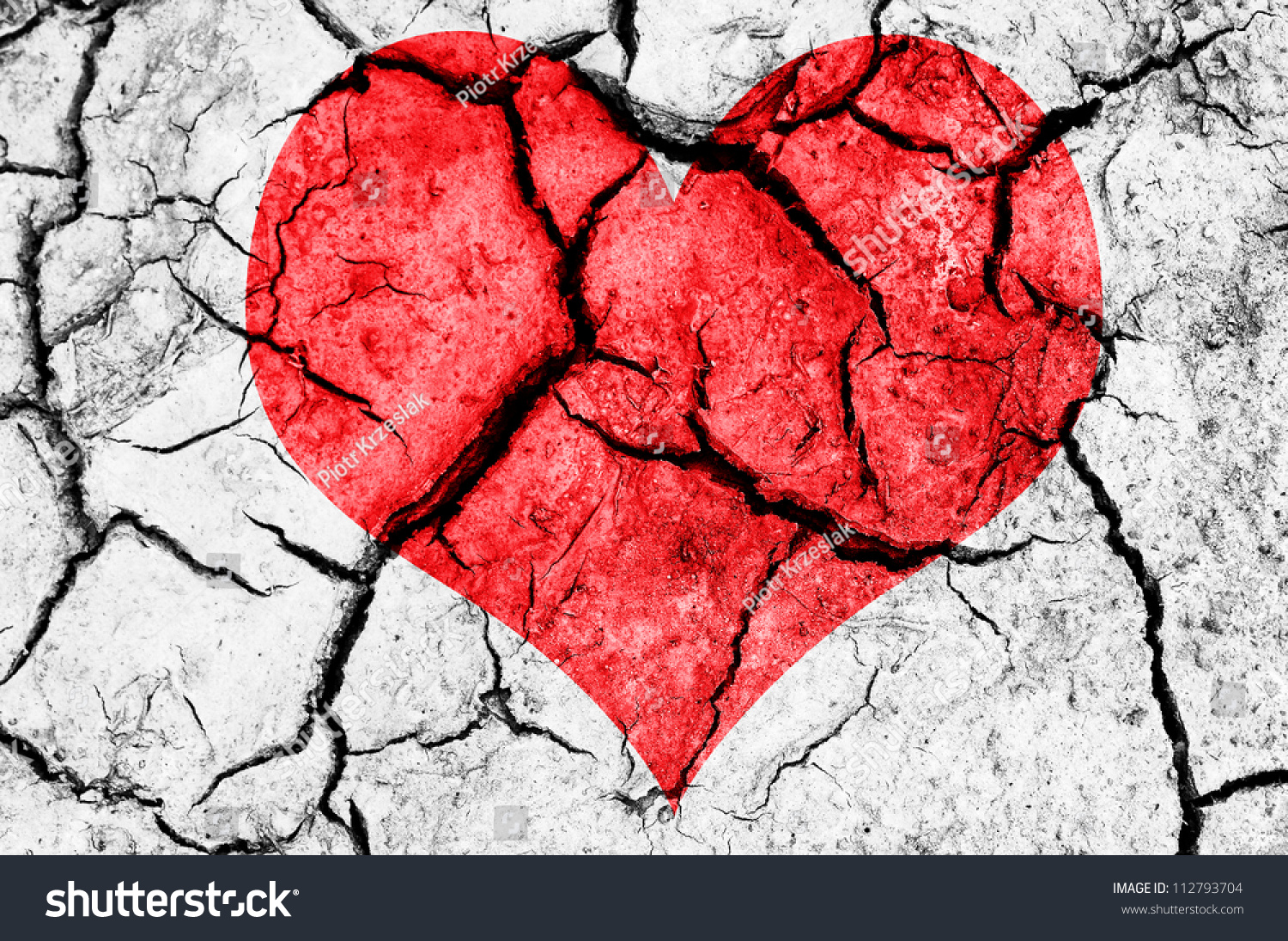 natural red heart shape in cracked dry soil #112793704