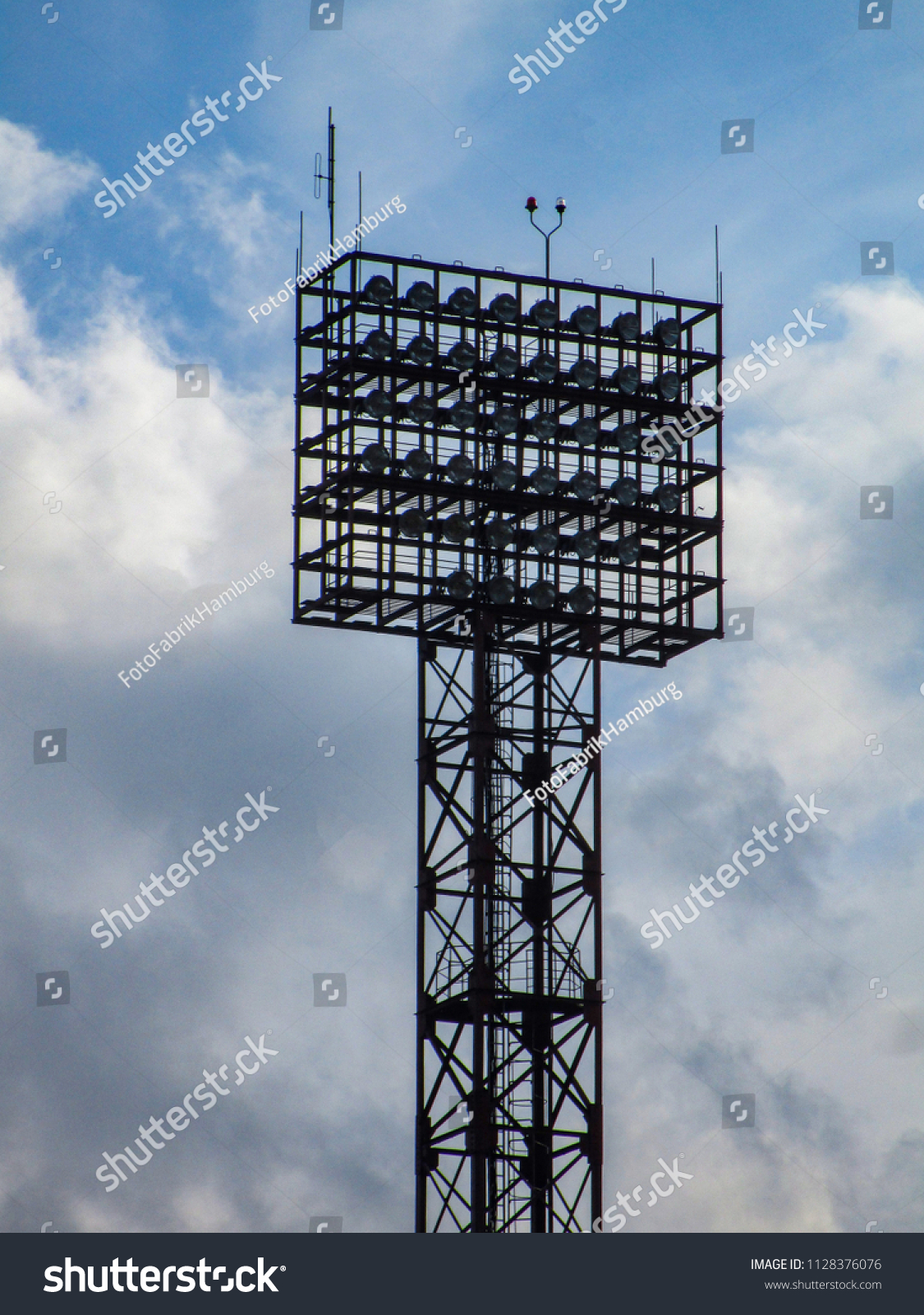 Floodlight pylons in a football stadium in Lithuania #1128376076