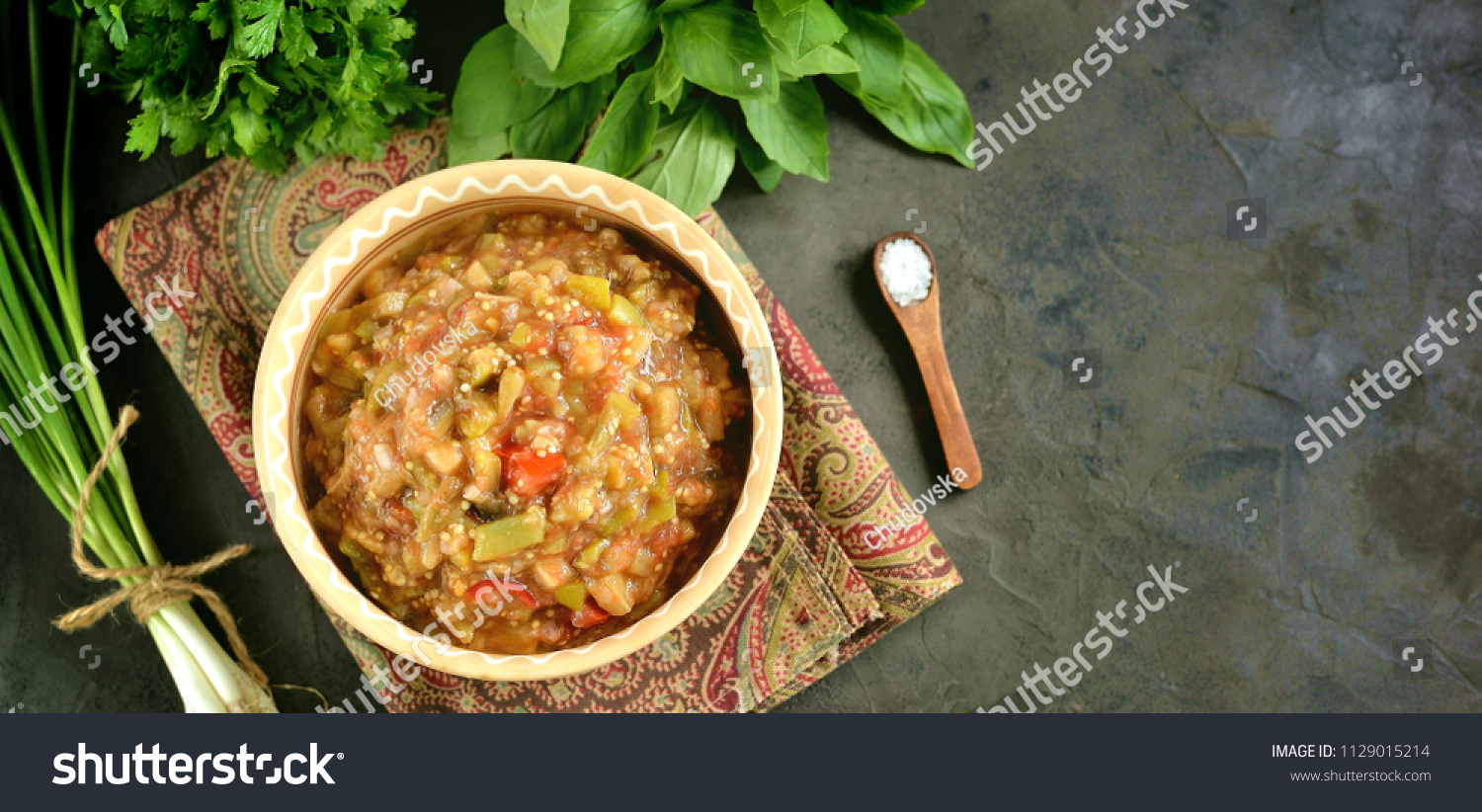 Middle Eastern cuisine - babaganush (eggplant caviar) from baked eggplant and pepper, with tomatoes, chili pepper, onion with olive oil and sea salt. #1129015214