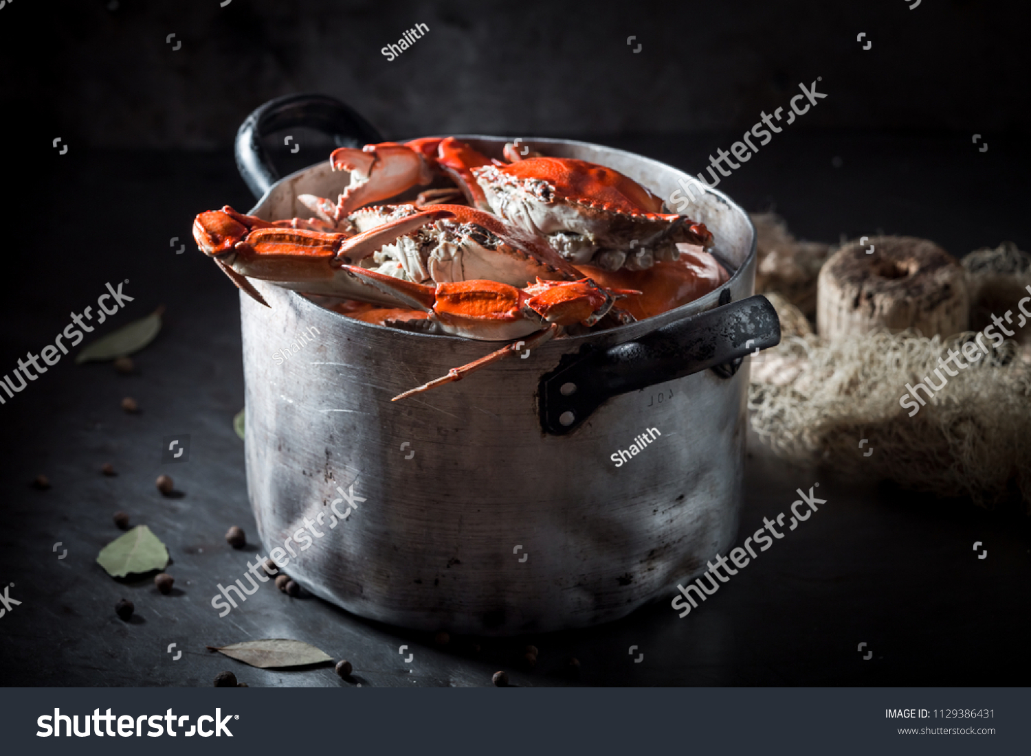 Tasty and fresh crab with allspice and bay leaf #1129386431