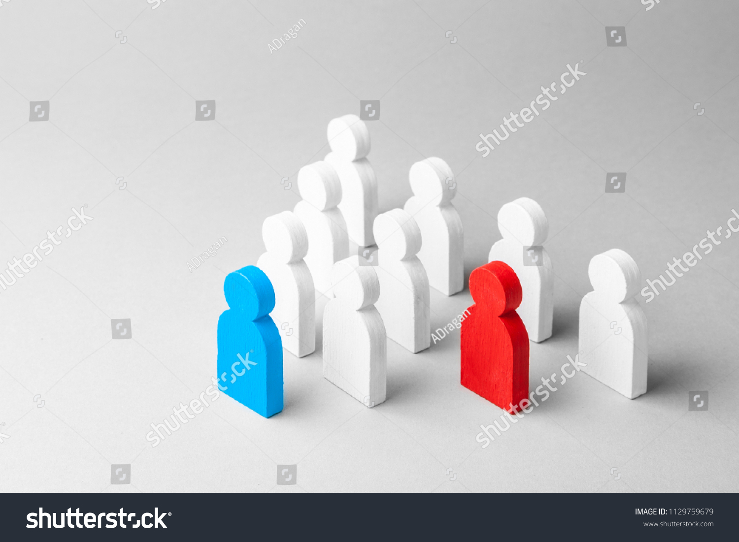 Concept leader of the business team indicates the direction of the movement towards the goal. Crowd of white men goes for the leader of the blue color and  bad conflicting employee of  red color #1129759679