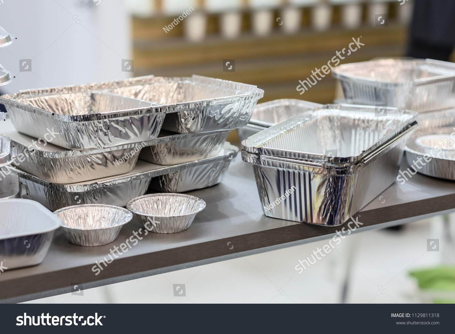 A lot of food aluminum containers. Metal forms for storing food. Forms for baking. #1129811318