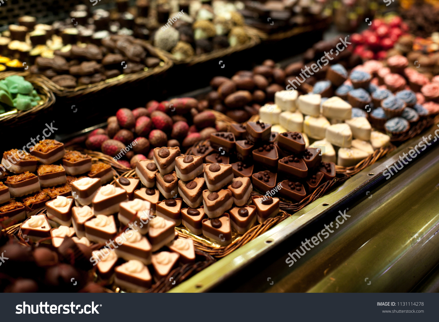 Famous sweet candy market .Confectionery at Boqueria market place in Barcelona, Spain. Assorted chocolate candy shop. #1131114278