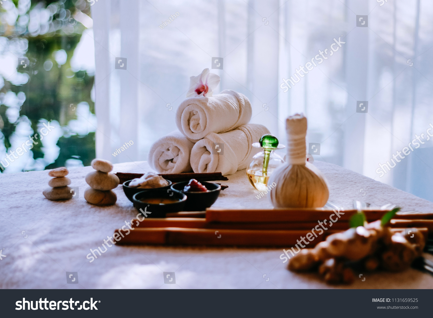 Thai herbal spa elements setting for traditional Thai massage, tropical spa treatment background concept. #1131659525