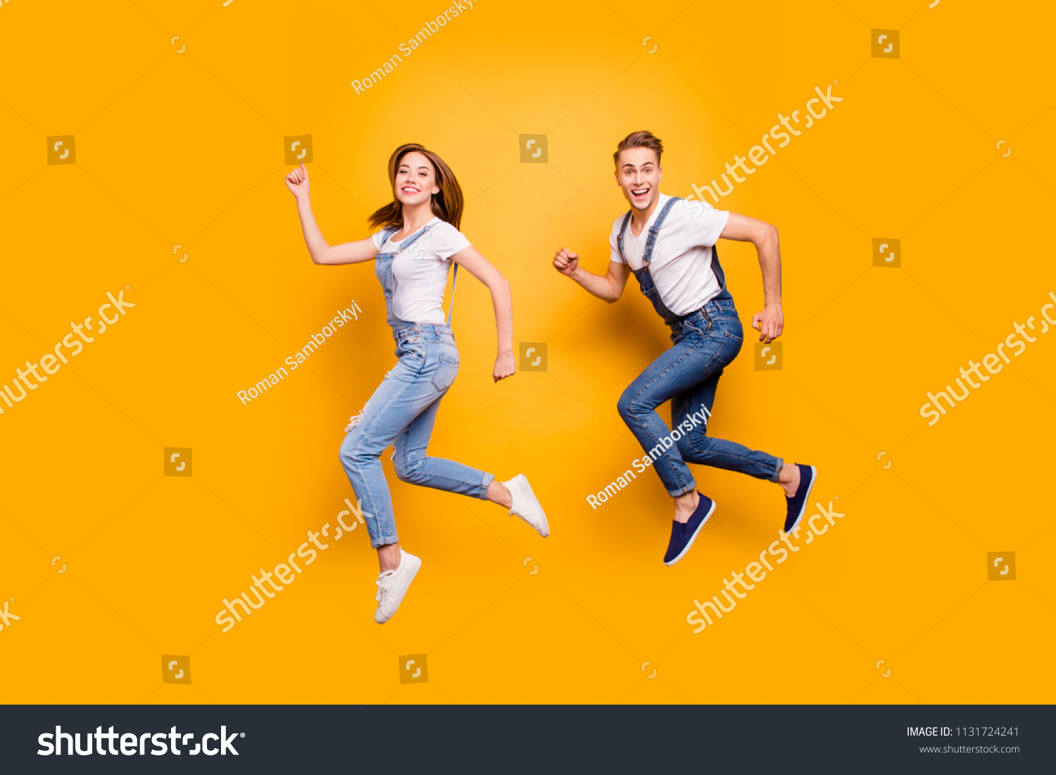 Summer dreamy student freedom fly teen age youth person concept. Side view full size length photo portrait of two cheerful rejoicing attractive handsome guy lady making movement isolated background #1131724241