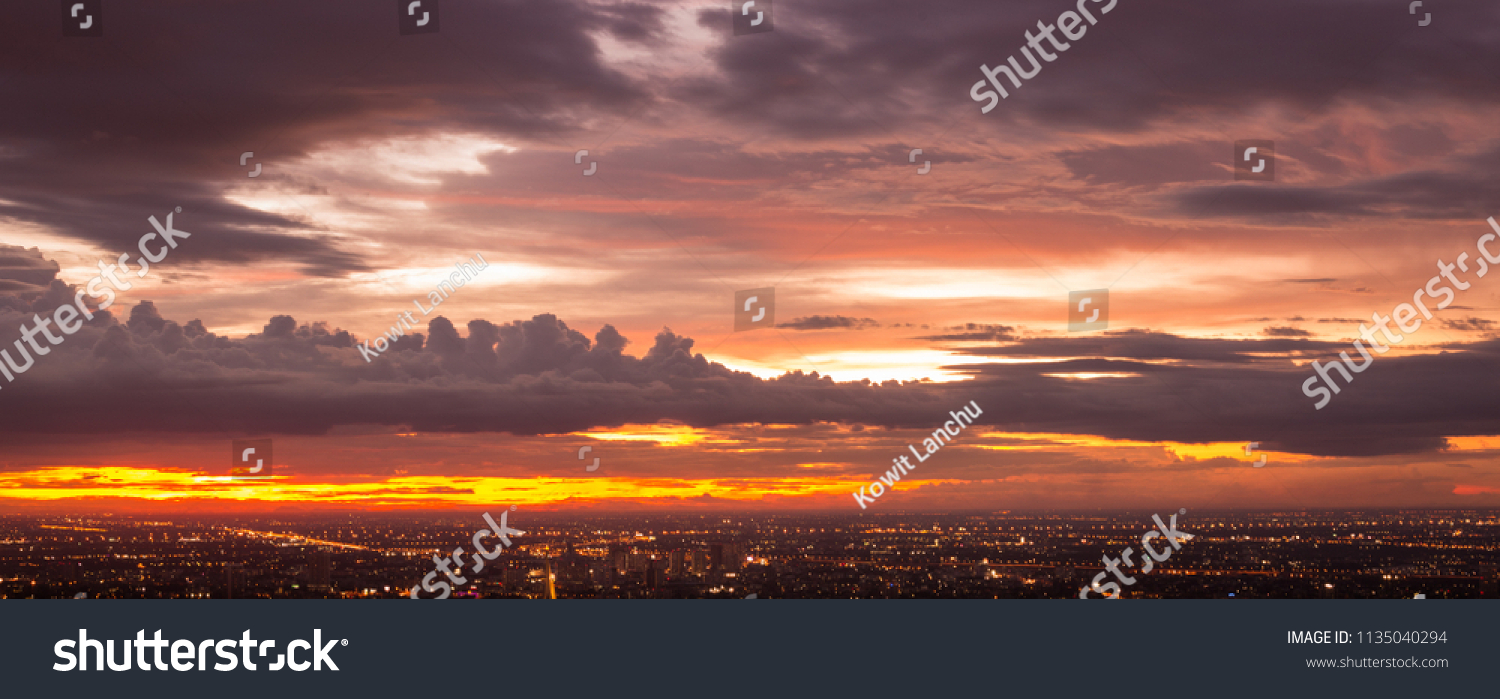 Colorful of sky and cloud in sunset,and twilight,with cityscape in the evening #1135040294