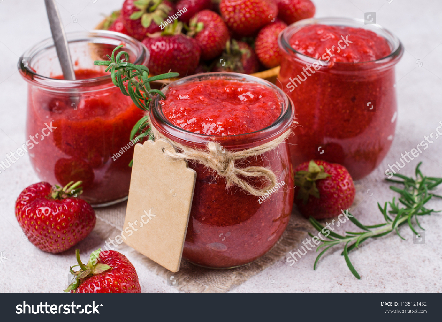 Red strawberry jam in a glass jar on the table. - Royalty Free Stock ...