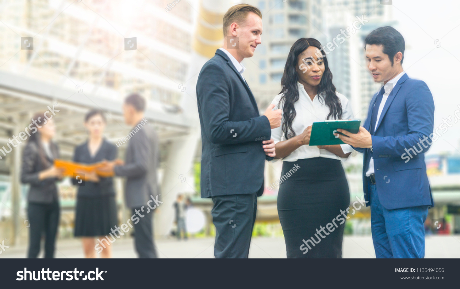 group of people business workers in suit cloth meet and talk at the outdoor city space #1135494056