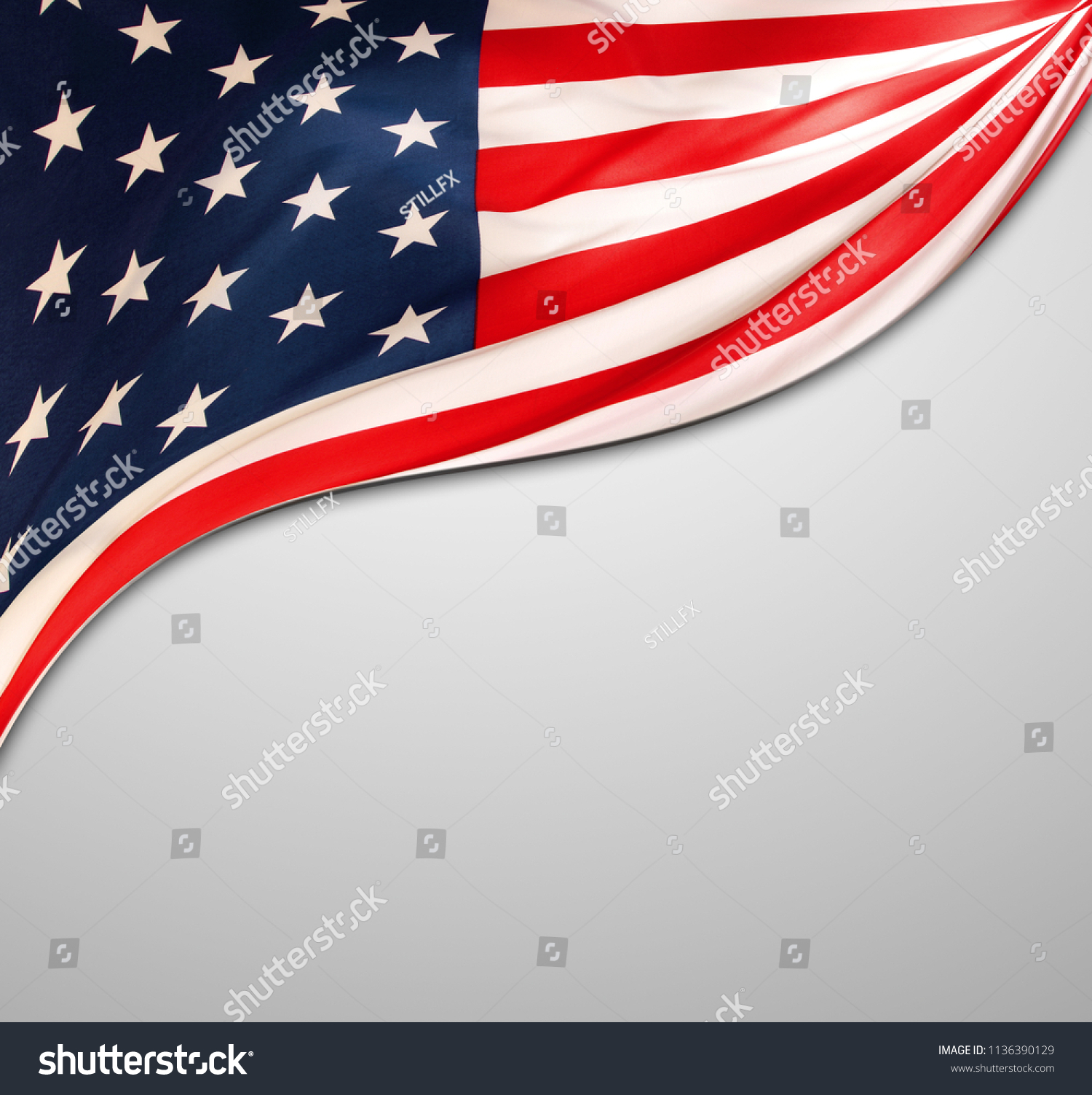 Closeup of American flag on grey background #1136390129