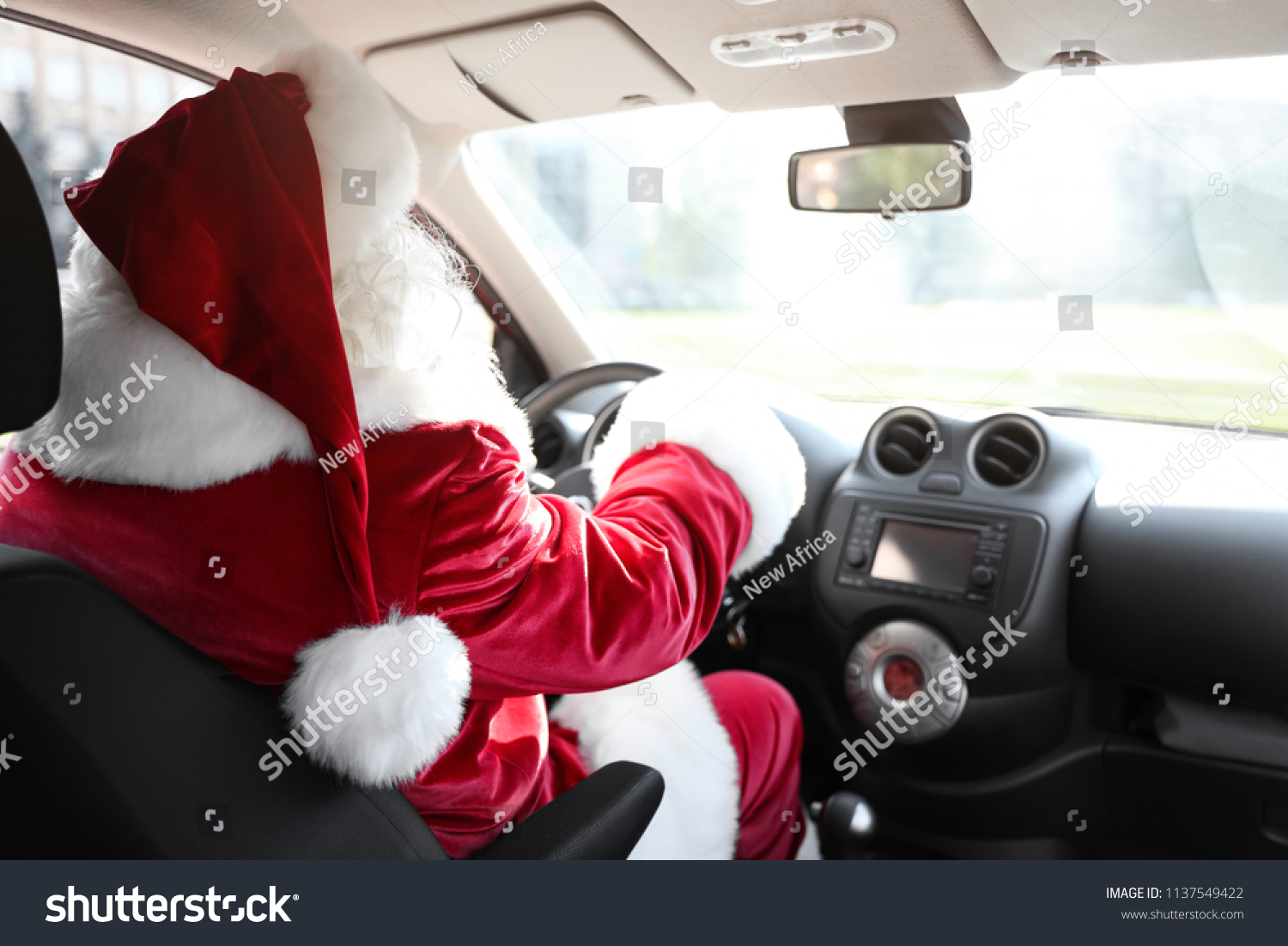 Authentic Santa Claus driving car, view from inside #1137549422