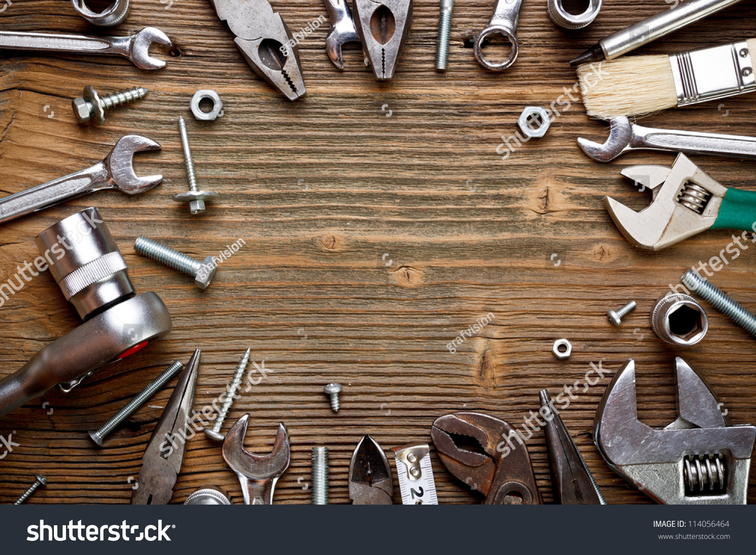Group of used tools on wood background #114056464