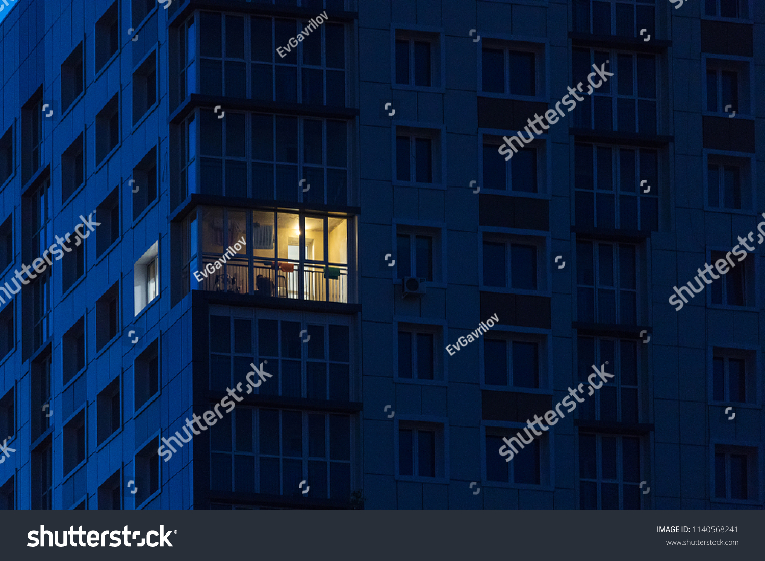 the light burns in one window of the multitude in a multi-storey residential building
 #1140568241
