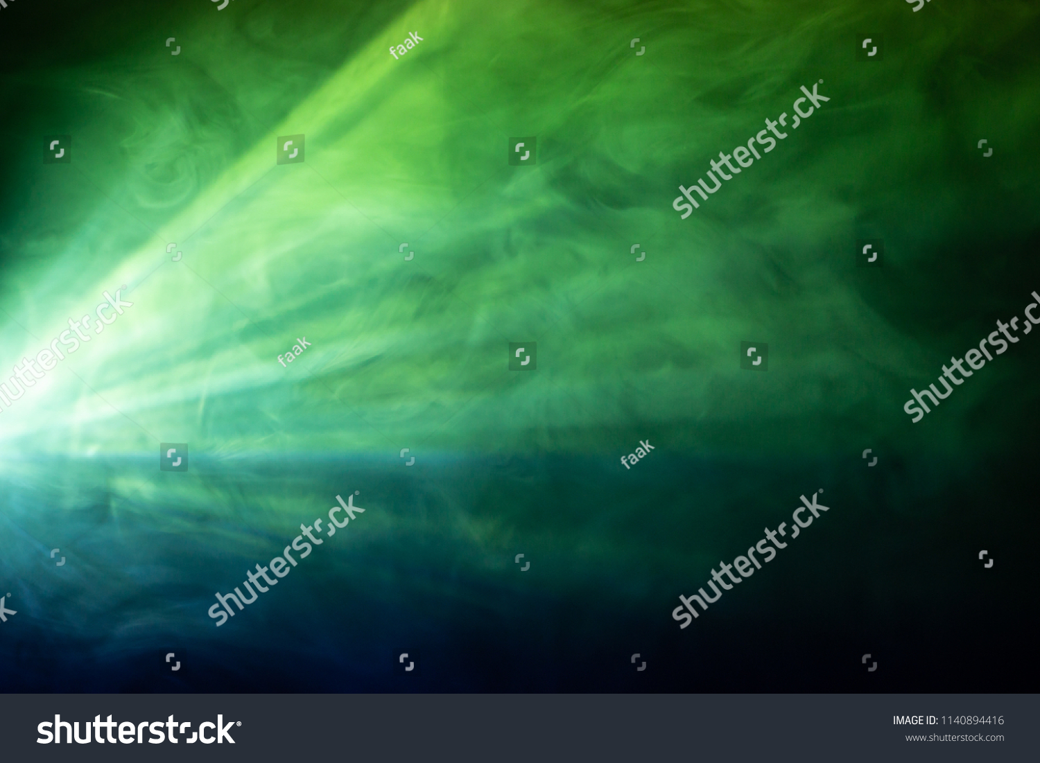 colorful beautiful spotlight . wide lens projector with light beam for movie and cinema at night . close up texture abstract smoke background . screening for multimedia . #1140894416