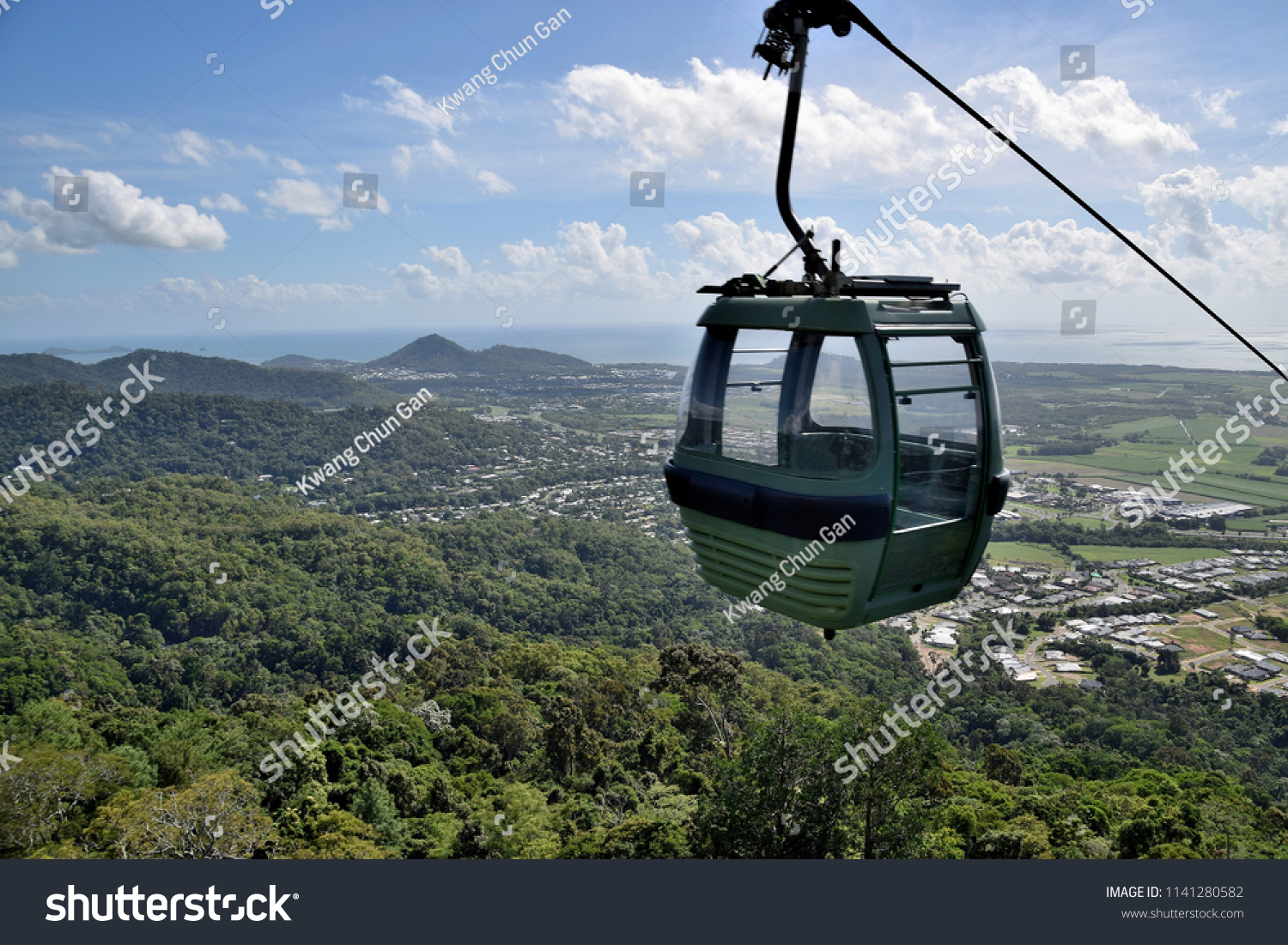 The cable car zips through the tropical rainforest of Cairns, in Northern Queensland, Australia. #1141280582