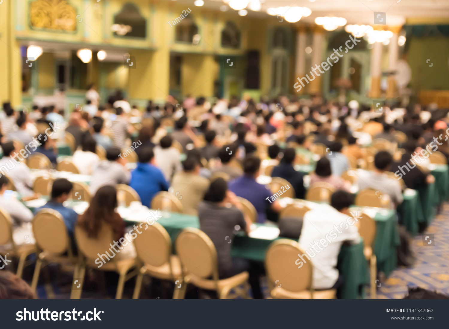 Abstract blurred photo background of business people in conference hall or seminar room.
Bokeh business meeting conference training learning coaching concept. #1141347062