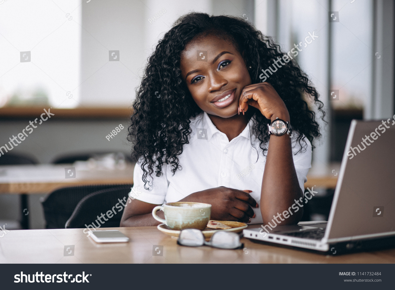 African american business woman with computer and coffee #1141732484