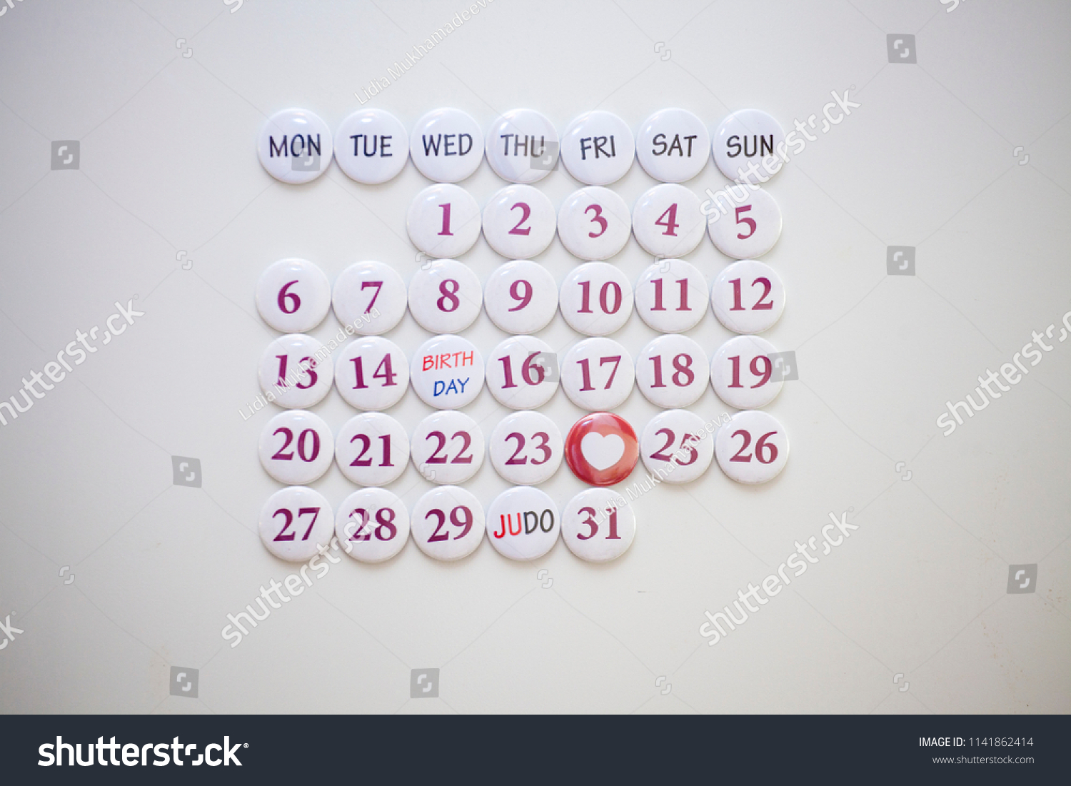 Collected calendar of round magnets. Monthly Planning #1141862414