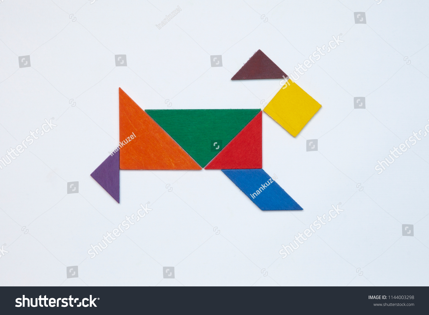 Tangram. Traditional Chinese dissection puzzle, seven tiling pieces - geometric shapes: triangles, square (rhombus), parallelogram. #1144003298