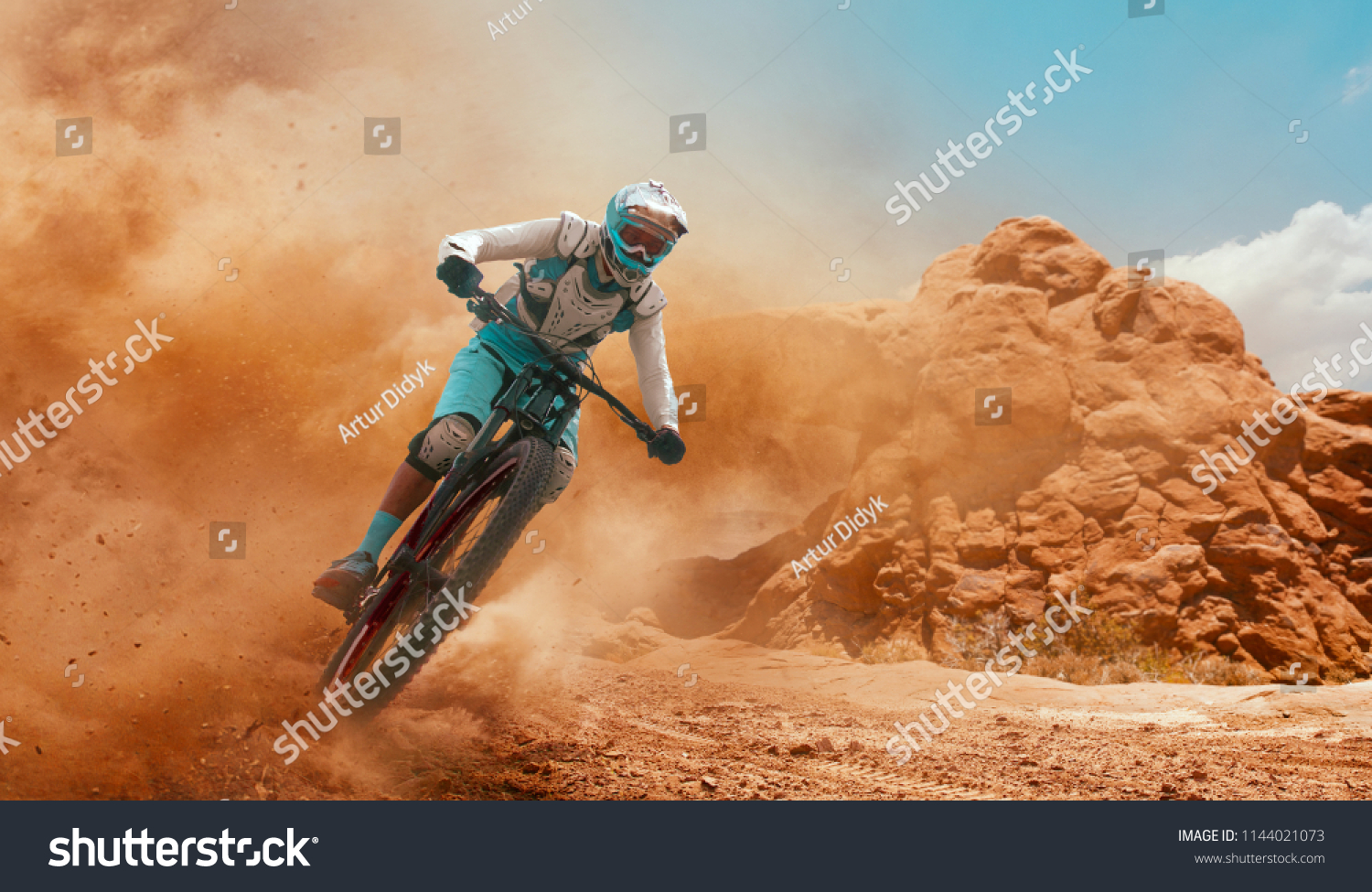 Cyclist riding a bicycle. Downhill. #1144021073