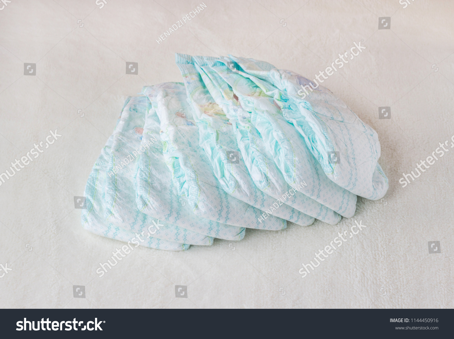 Baby diapers on a white background, diapers for babies #1144450916