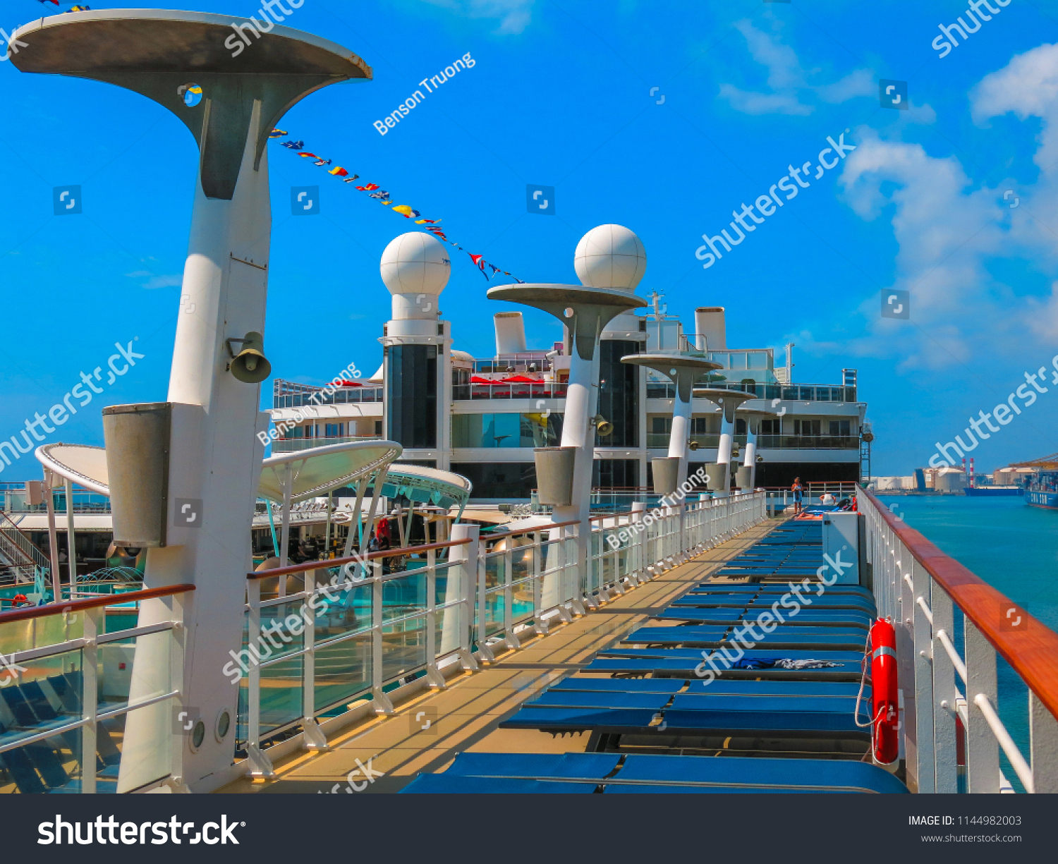 Naples, Italy. July 2nd, 2014. Sun chairs and a jogging track on the top deck of Norwegian Cruise Line Epic. Taken while docked on a sunny day.  #1144982003