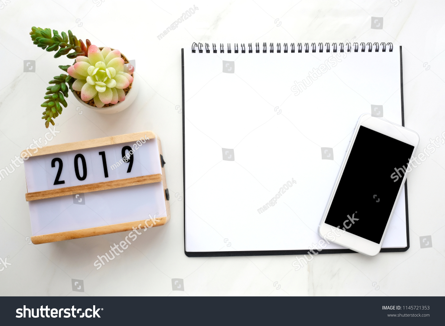 2019 goal resolution for new year, Blank note book paper, smart phone with blank screen on white marble background, 2019 new year mock up, template, flat lay #1145721353
