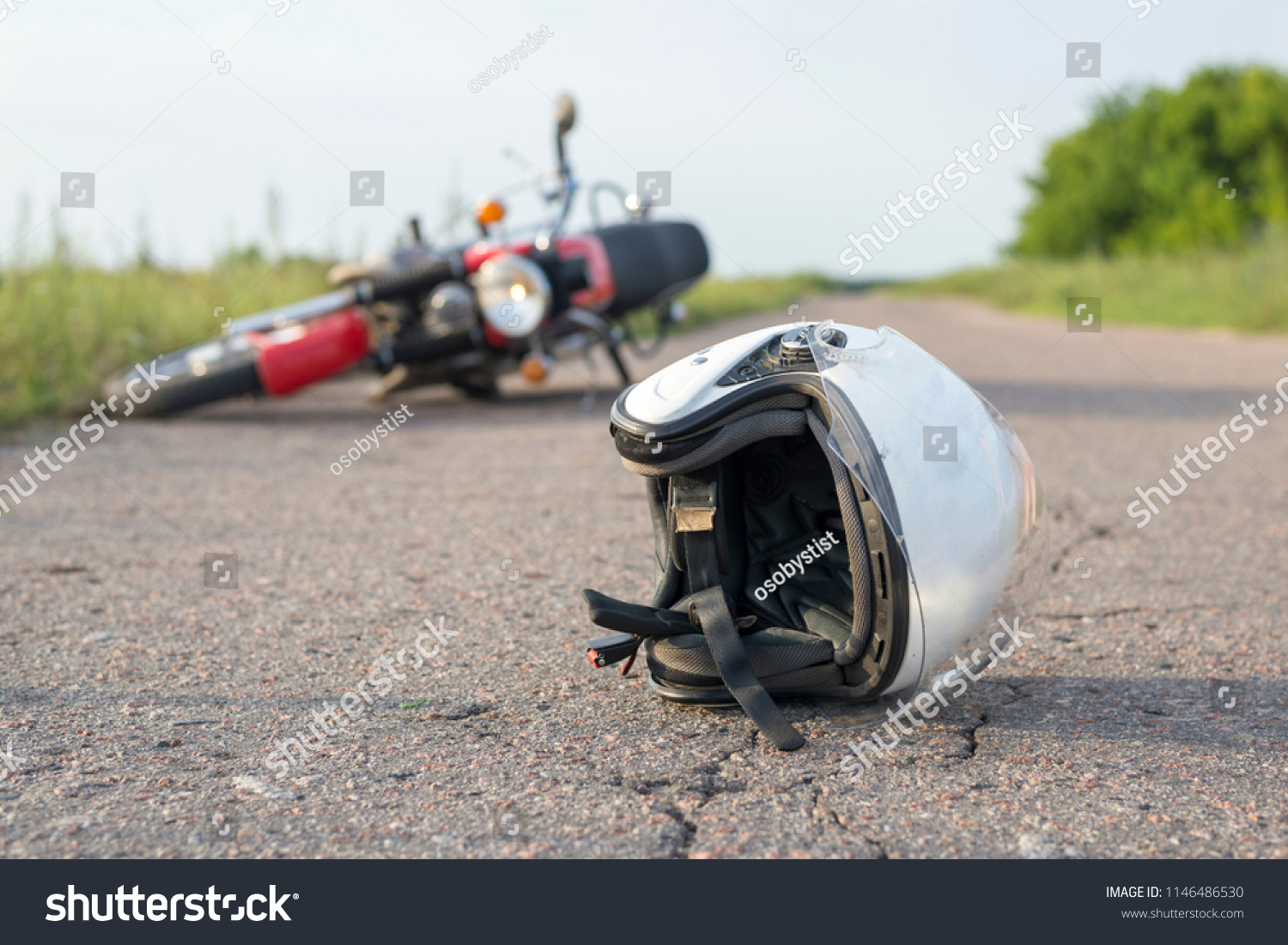 Photo of helmet and motorcycle on road, the concept of road accidents #1146486530