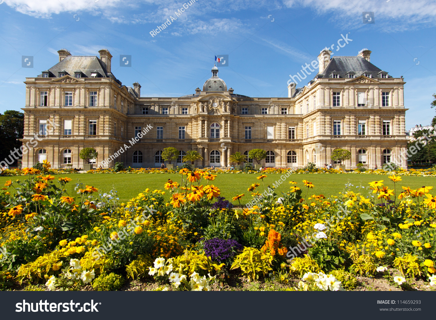 Color DSLR landscape picture of the Palace in Luxembourg Gardens, Paris, France; with colorful flowers and copy space for text.  Popular with tourists and Parisians, though no people are seen. #114659293