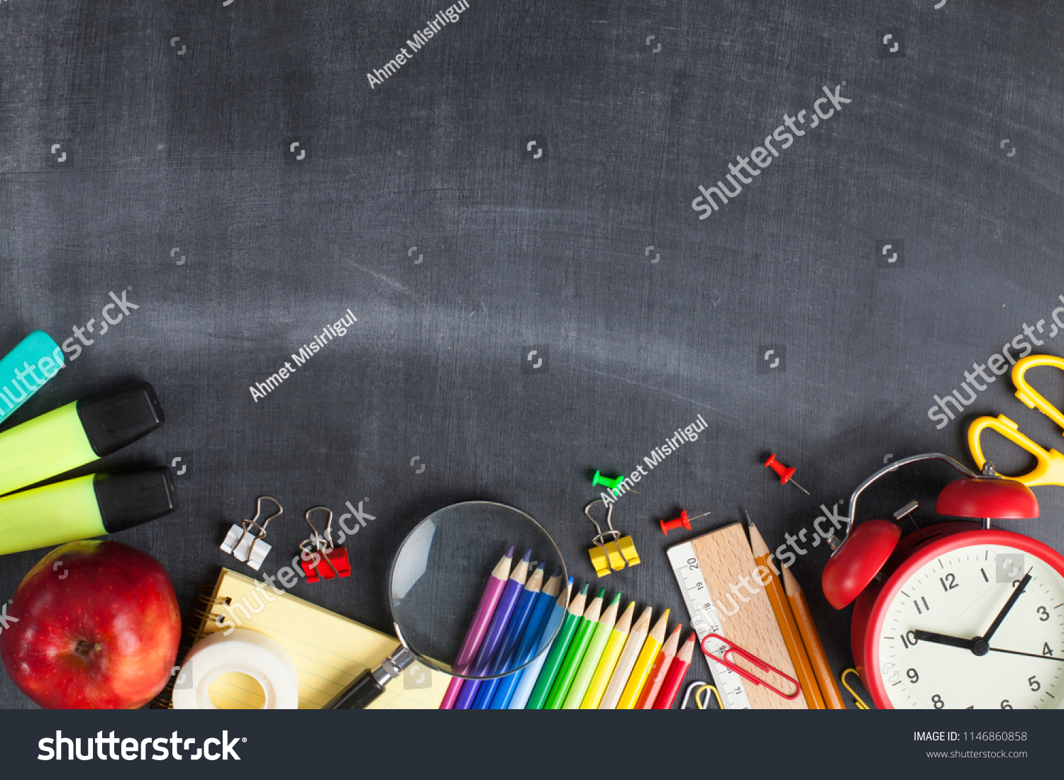 School supplies on black board background. Back to school concept #1146860858