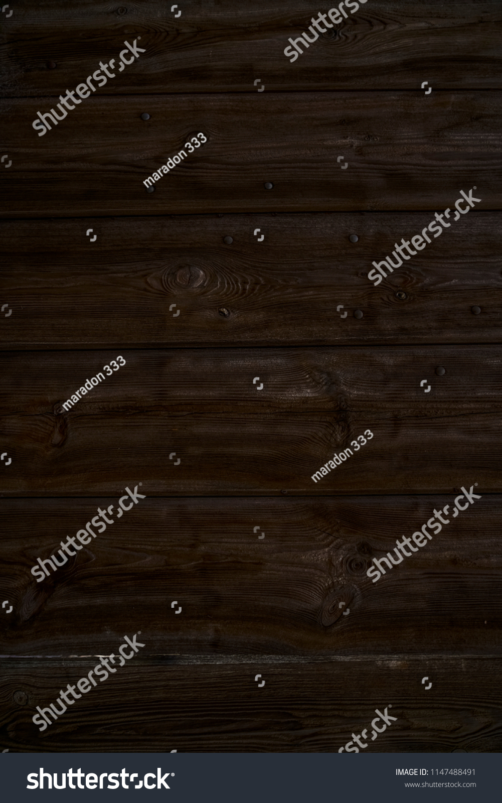 Old dark cherry wood background. Red wooden board plank texture. Beautiful natural rustic photo backdrop for vintage hipster design #1147488491