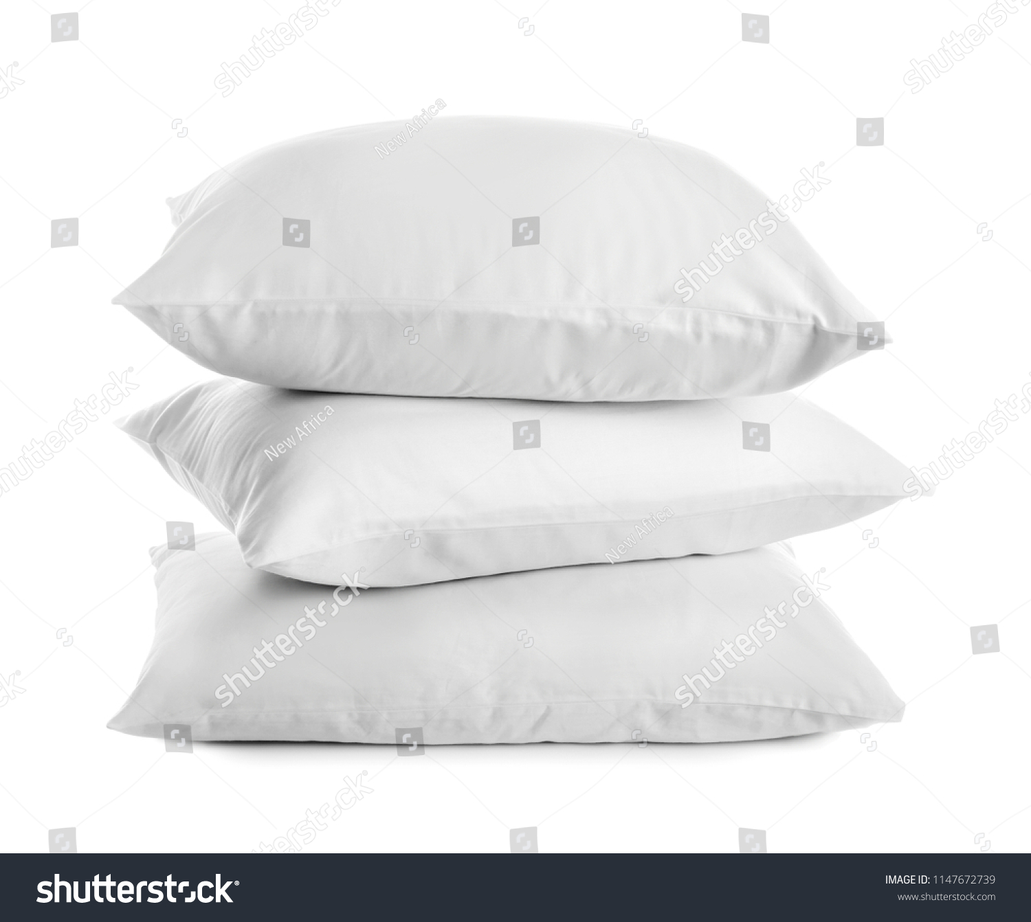 Clean soft bed pillows on white background #1147672739