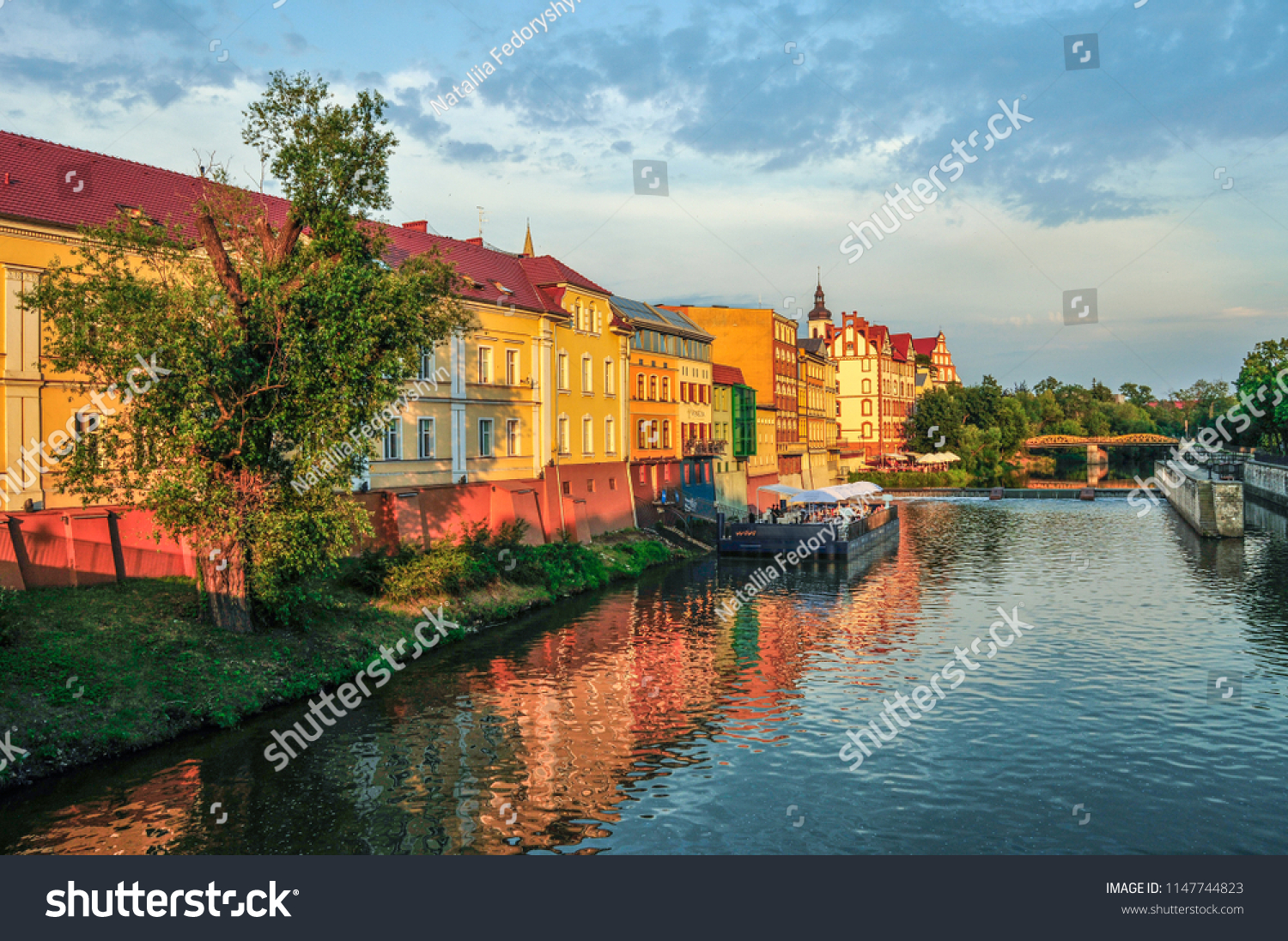 Landscape, old buildings under the river, Poland, sunset #1147744823
