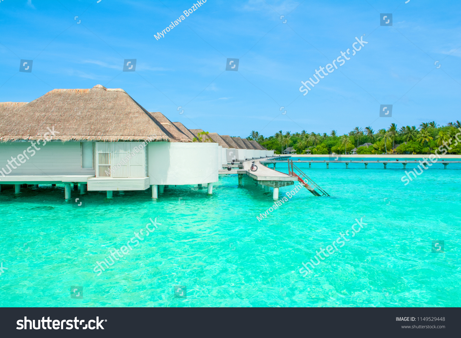 Lhaviyani Atoll, Maldives - 12 July 2018: Beautiful landscape of over water villas in luxury hotel, Kanuhura island #1149529448