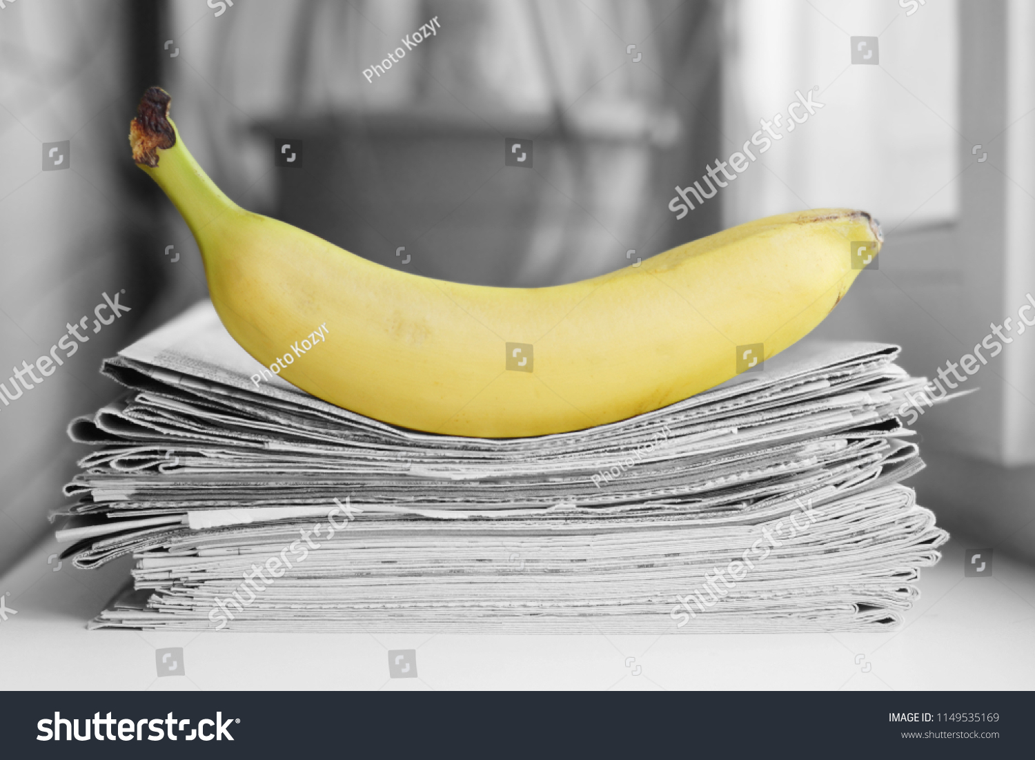 Stack of newspapers and banana. Daily journals with headlines and articles and fresh fruits. Concept for juicy news                                    #1149535169