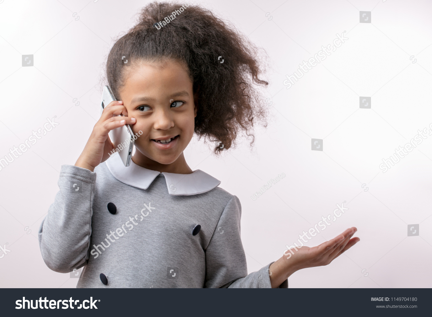 positive little girl using cell phone. phone conversation. copy space. free time. entertainment #1149704180