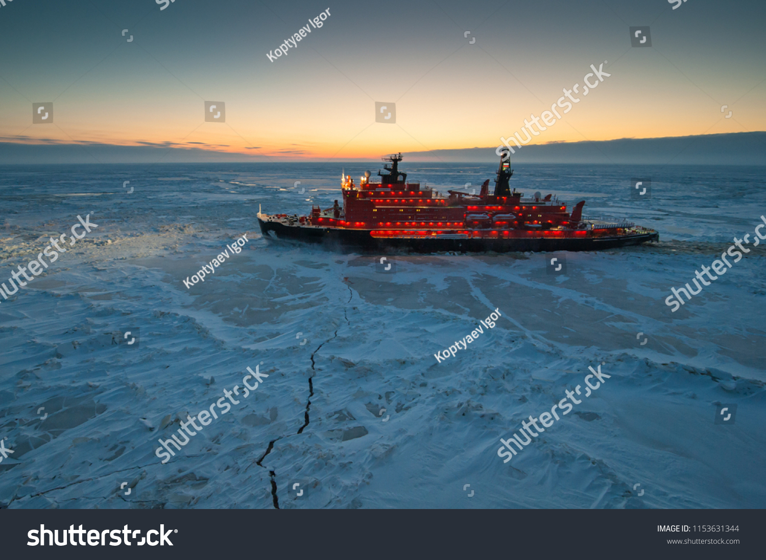 Icebreaking vessel in Arctic with background of sunset #1153631344