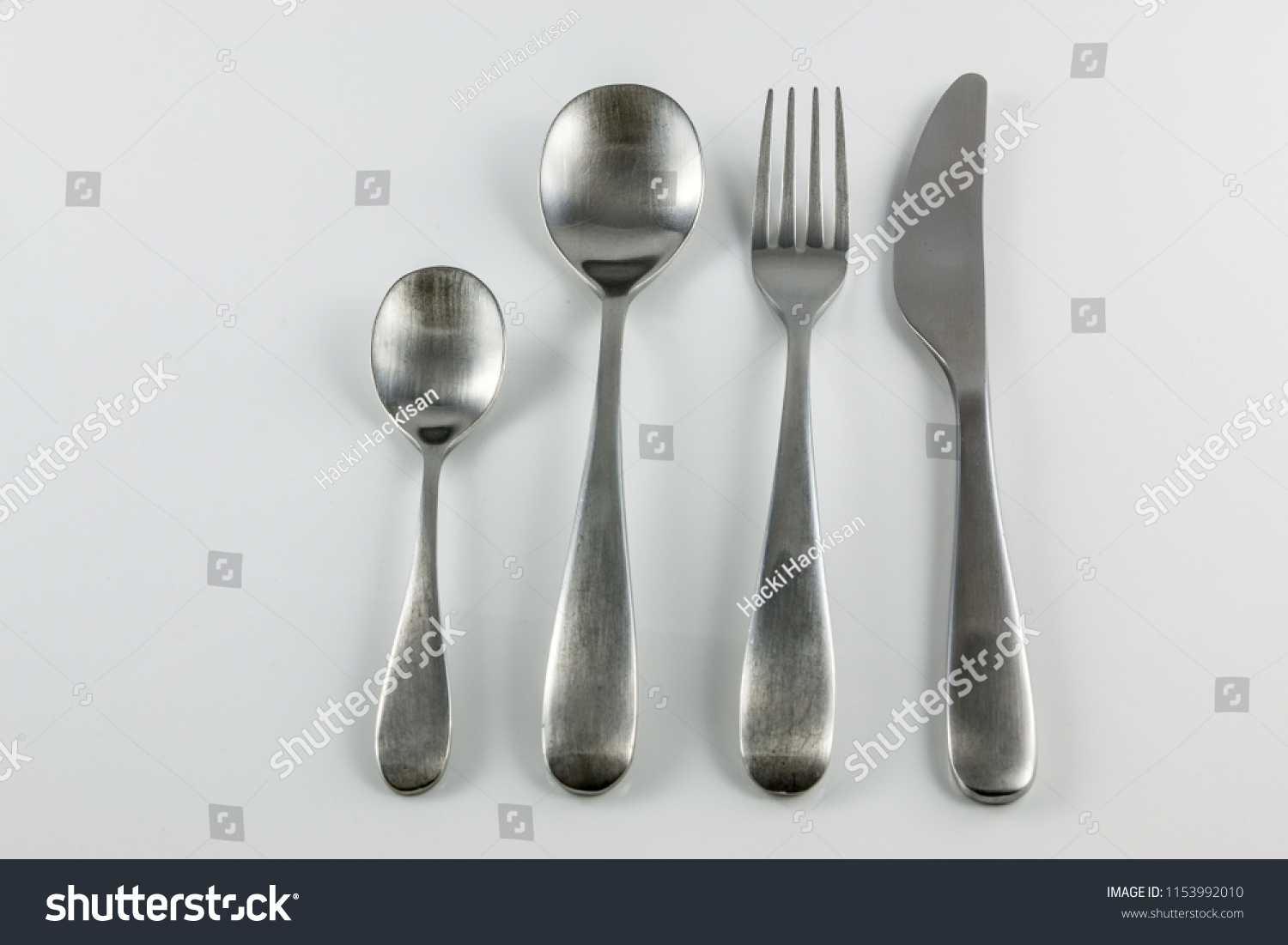 Cutlery with knife, fork, table spoon and little spoon #1153992010