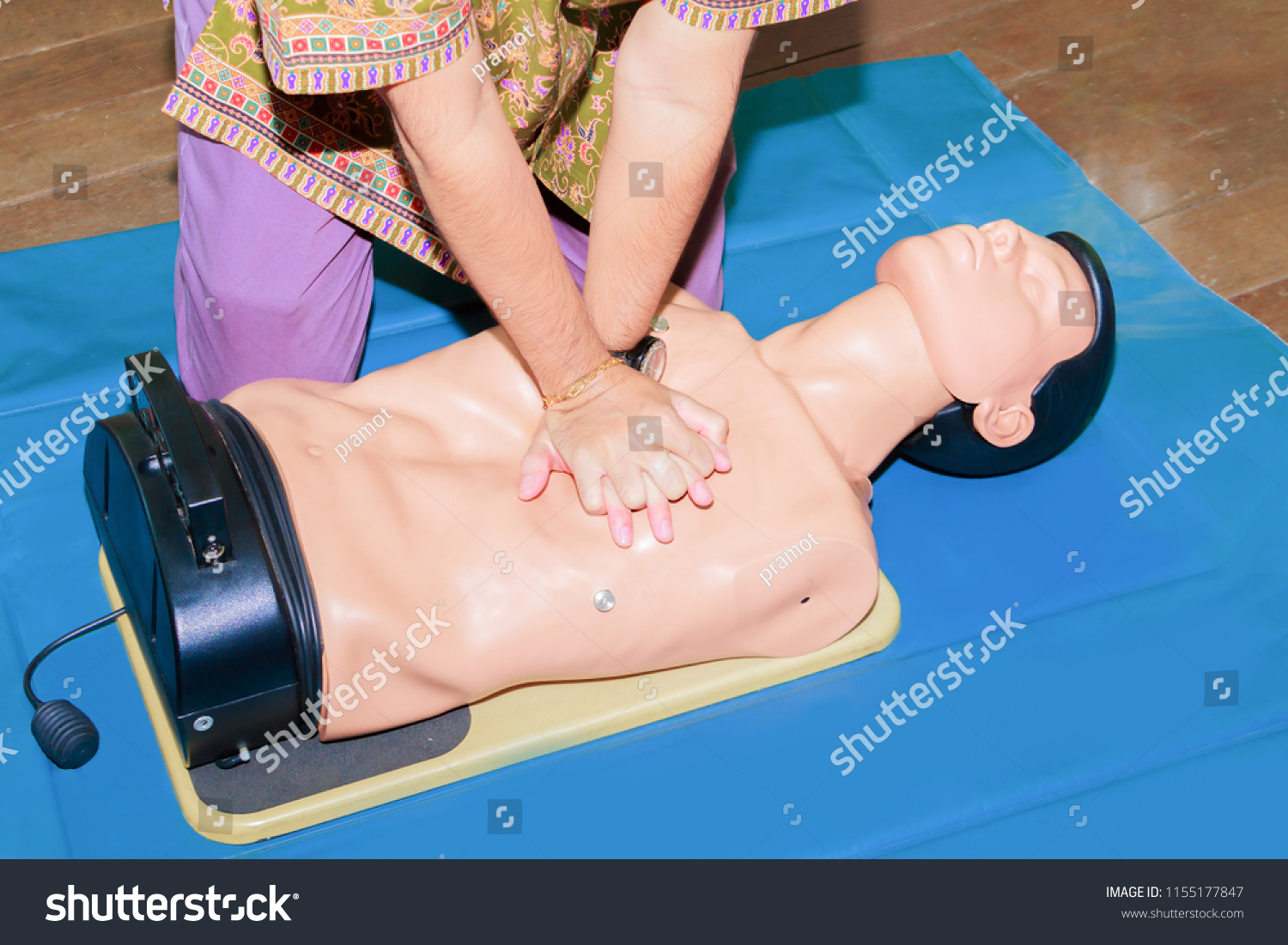 hand student Heart pump with medical dummy on CPR, in emergency refresher training to assist of physician #1155177847