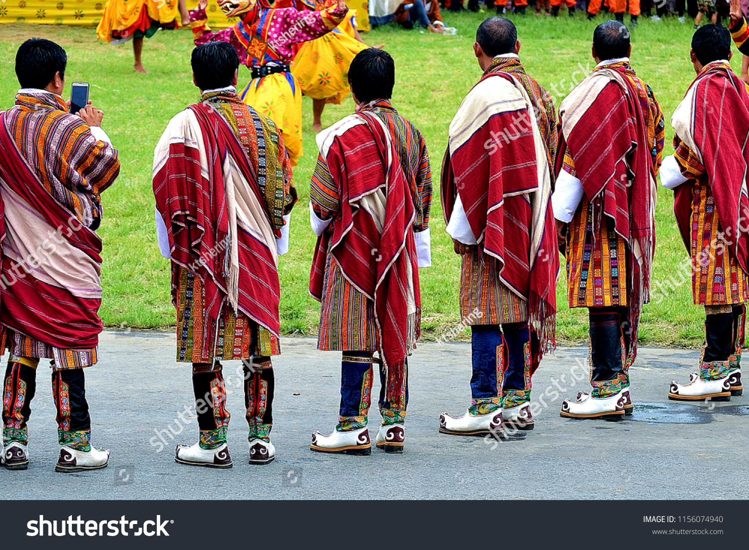 Bhutanese men in their best traditional attire. Bhutanese are fond of their unique dress which they proudly wear at all times. Shown in the picture is Bhutanese clergy men in their formal dress. #1156074940