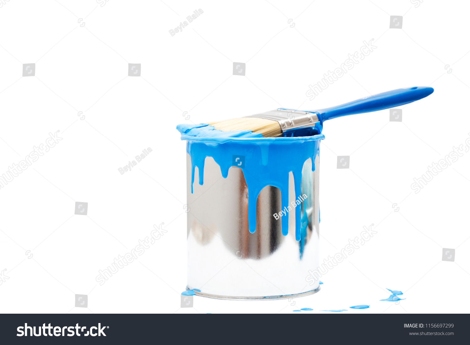 open, painted bucket and paintbrush on a white backdrop. #1156697299